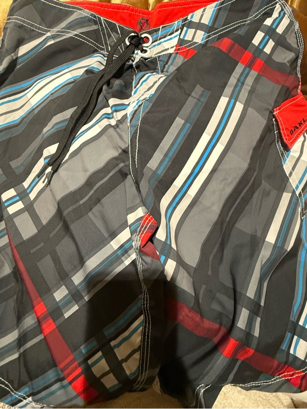 Oakley Men's Gray Plaid Swim Trunks with Blue and Red Accents